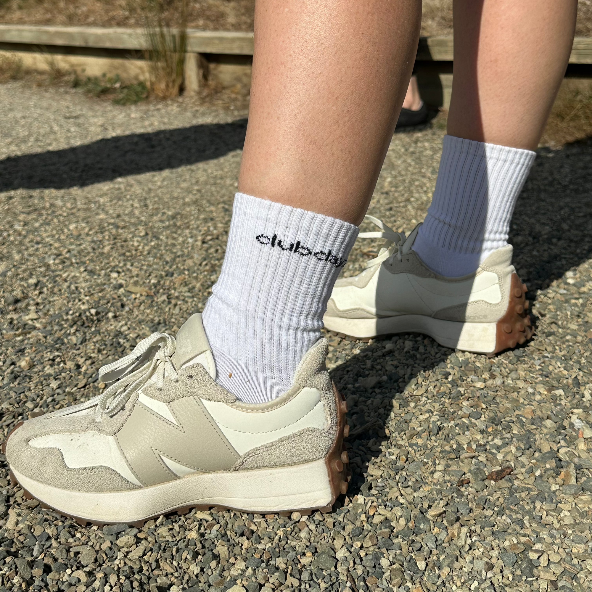 Women standing wearing white socks